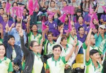 Barangay Nutrition Scholars enthusiastically wave flags during the BNS Big Day in Passi City Arena, showing their eagerness to championing food security and nutrition initiatives in Iloilo Province. Photo from Balita Halin sa Kapitolyo