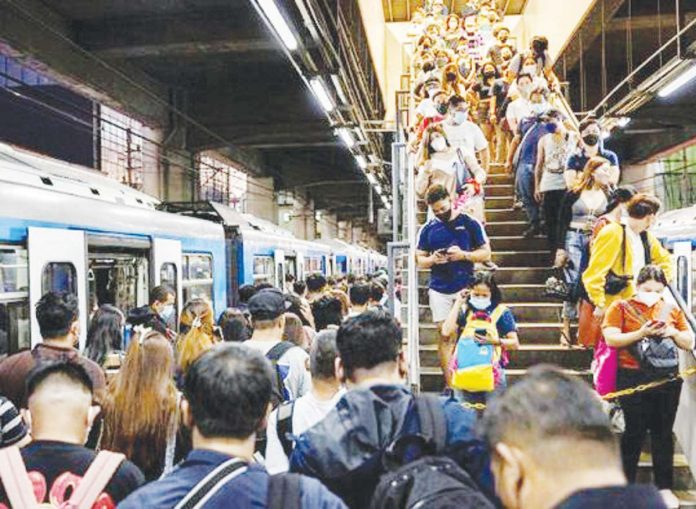 The International Monetary Fund projected that 14 percent of the total workforce in the Philippines is at risk of being replaced by artificial intelligence. File photo shows passengers queuing to ride a train while others exit at a station in Manila. REUTERS/ELOISA LOPEZ