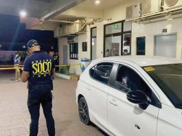 A Scene of the Crime Operative (SOCO) personnel examines the vehicle used by the drug suspects following the buy-bust operation in Barangay Balabago, Jaro, Iloilo City. ICPO PHOTO