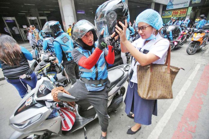 The Land Transportation Franchising and Regulatory Board supports the need to legalize motorcycles-for-hire, saying that this mode of transportation will fill the gaps of the "imperfect" land transportation system. DANNY PATA PHOTO