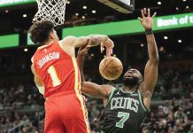 Atlanta Hawks’ Jalen Johnson (1) blocks a shot by Boston Celtics’ Jaylen Brown (7). AP PHOTO/ROBERT F. BUKATY