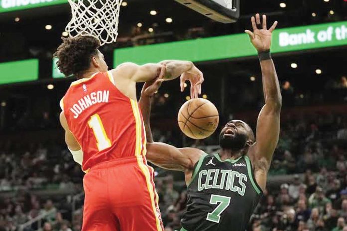 Atlanta Hawks’ Jalen Johnson (1) blocks a shot by Boston Celtics’ Jaylen Brown (7). AP PHOTO/ROBERT F. BUKATY