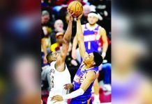 Cleveland Cavaliers center Tristan Thompson (13) blocks a shot by Phoenix Suns forward Ryan Dunn (0). Photo courtesy of David Richard/Imagn Images