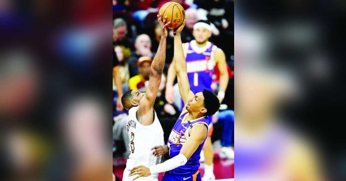 Cleveland Cavaliers center Tristan Thompson (13) blocks a shot by Phoenix Suns forward Ryan Dunn (0). Photo courtesy of David Richard/Imagn Images