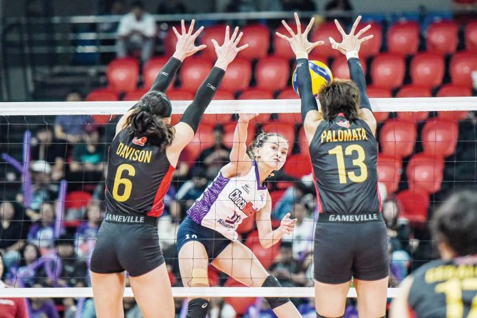 Choco Mucho Flying Titans’ Cherry Rondina scores against two PLDT High Speed Hitters defenders. PVL PHOTO