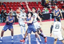 Rain or Shine Elasto Painters’ Adrian Nocum eludes the defense of Blackwater Bossing’s Bradwyn Guinto for a layup. PBA PHOTO