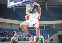 Phoenix Fuel Masters’ Donovan Smith hangs in the ring after a two-handed dunk. PBA PHOTO