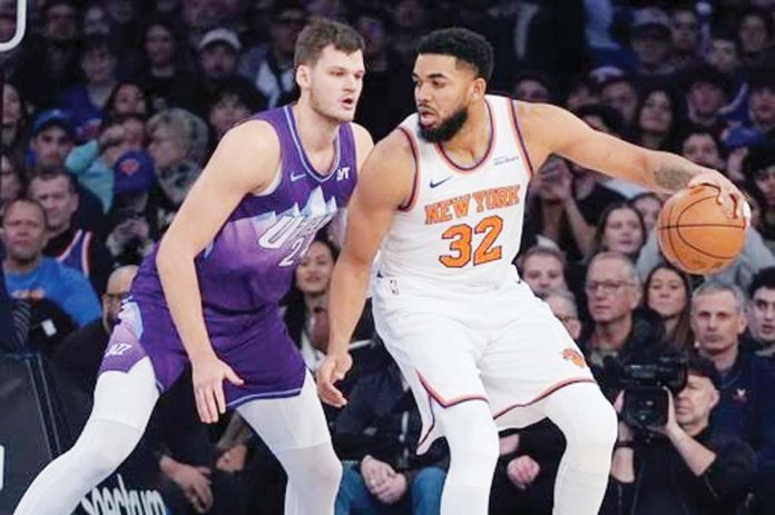 New York Knicks’ Karl-Anthony Towns attacks the defense of Utah Jazz’s Walker Kessler. AP