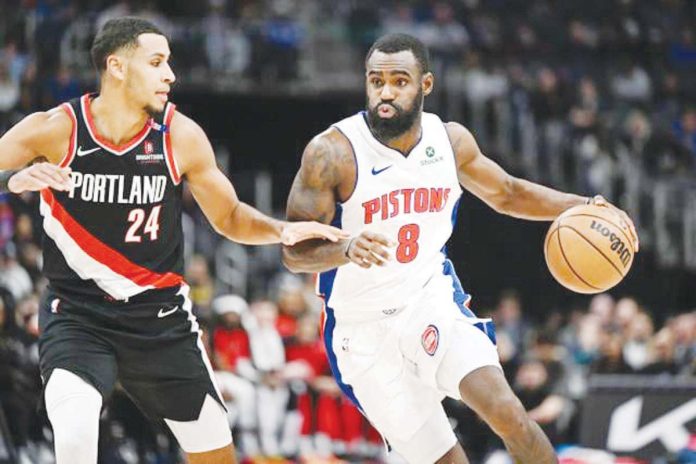 Detroit Pistons’ Tim Hardaway Jr. (8) drives past the defense of Portland Trail Blazers' Kris Murray (24). LON HORWEDEL/IMAGN IMAGES