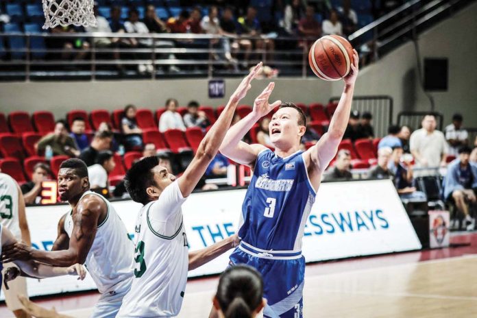 Hong Kong Eastern’s Ramon Cao tries to score against the defense of Terrafirma Dyip's Kemark Cariño. PBA PHOTO