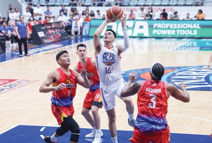 NLEX Road Warriors’ Jonnel Policarpio goes for an inside basket. PBA PHOTO