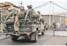 Members of the M23 armed group arrive in a pickup truck at the compound where residents gather for a protest against the Congolese government, expressing support for the M23 armed group in Goma on January 31, 2025. GETTY IMAGES