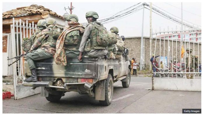 Members of the M23 armed group arrive in a pickup truck at the compound where residents gather for a protest against the Congolese government, expressing support for the M23 armed group in Goma on January 31, 2025. GETTY IMAGES