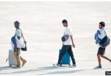 Three people released from scam centers walk across a tarmac in Mynamar. The scammers look for workers with skills in the languages of those who are targeted for cyber-fraud, usually English and Chinese. THAI NEWS PIX