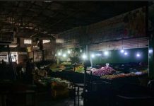 Fruit stalls are seen in Kirimandala Market during a power cut in Colombo, Sri Lanka. GETTY IMAGES