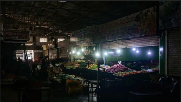 Fruit stalls are seen in Kirimandala Market during a power cut in Colombo, Sri Lanka. GETTY IMAGES