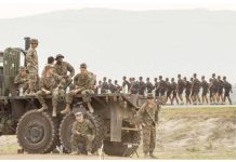 US troops look on as Philippine military cadets train at a naval base where the annual joint military exercises between US and Philippine troops called “Balikatan” or shoulder-to-shoulder are held in San Antonio, Zambales province, Philippines, April 26, 2023. REUTERS