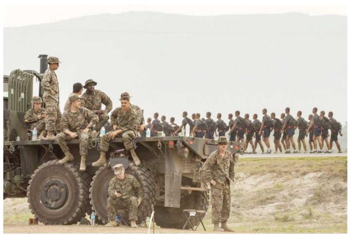 US troops look on as Philippine military cadets train at a naval base where the annual joint military exercises between US and Philippine troops called “Balikatan” or shoulder-to-shoulder are held in San Antonio, Zambales province, Philippines, April 26, 2023. REUTERS