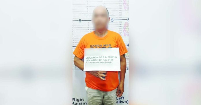 Police nabbed this 42-year-old man and seized suspected shabu and a firearm during a raid on Feb. 19, 2025 in Barangay Daja Norte, Banga, Aklan. AKLAN PPO PHOTO