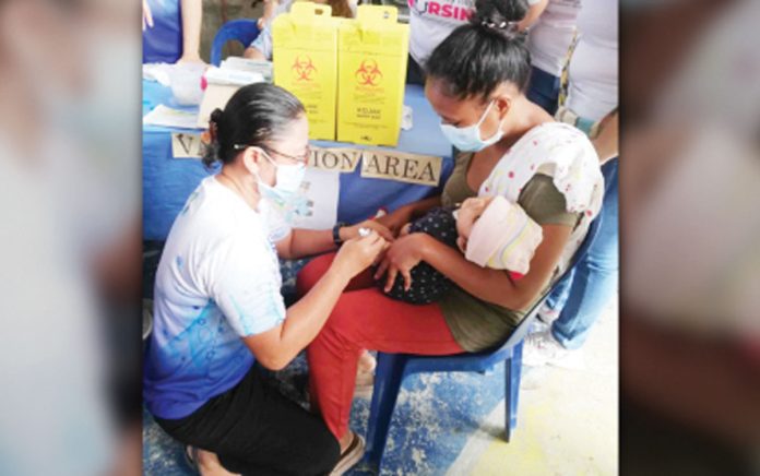 An infant receives a vaccine during the Department of Health’s “Big Catch-Up” immunization program at Barangay Supa Gymnasium in San Jose de Buenavista, Antique on Wednesday, Feb. 26, 2025. PNA PHOTO BY ANNABEL CONSUELO J. PETINGLAY