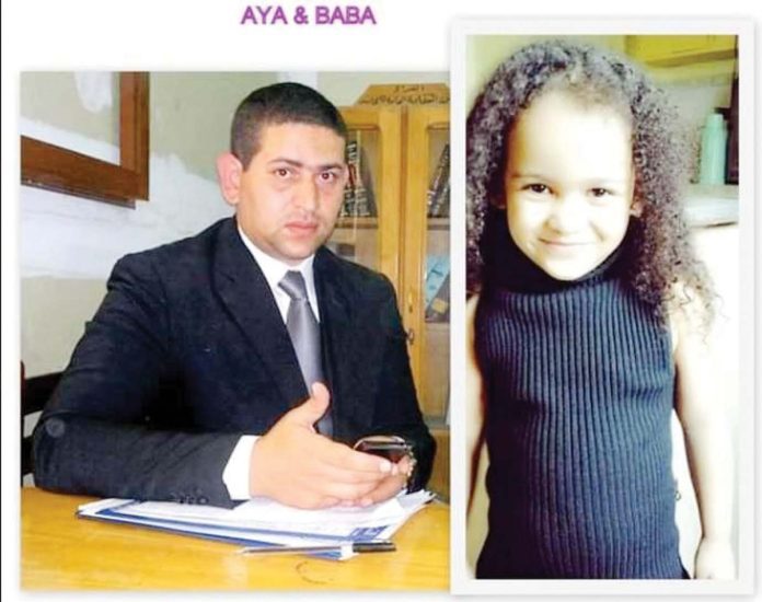 Little Aya (right) and her Baba (biological father)