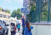 Personnel of the Commission on Elections (Comelec) in Bacolod City remove illegal campaign materials on Tuesday, Feb. 11, 2025, in Barangay Singcang-Airport.