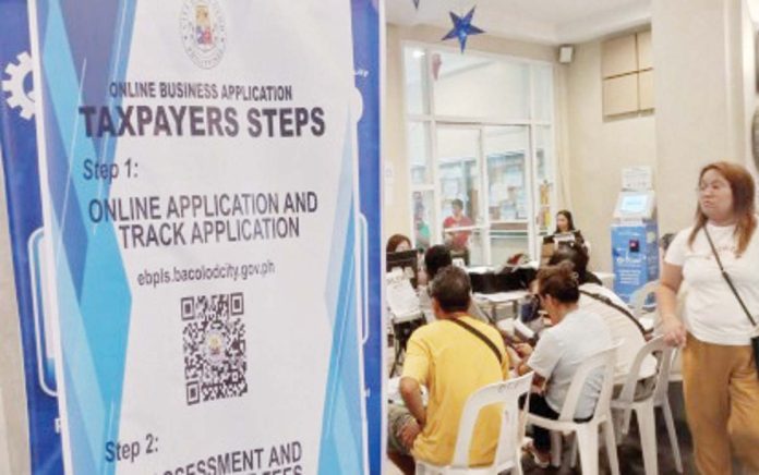 Applicants for business registration line up at the one-stop-shop in the lobby of the Bacolod City Government Center on Jan. 21, 2025. As of February 7, 18,875 businesses in the city have already registered. PNA PHOTO BY NANETTE L. GUADALQUIVER