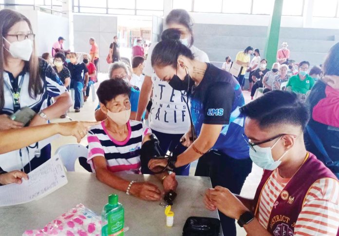 Municipal health workers conduct blood pressure monitoring for residents of Sta. Barbara, Iloilo. Blood pressure monitoring is a measure to screen individuals who may be suffering from hypertension. Once hypertension is detected, individuals are referred to the Rural Health Unit for management and monitoring of high blood pressure. ILOILO PROVINCIAL HEALTH OFFICE PHOTO