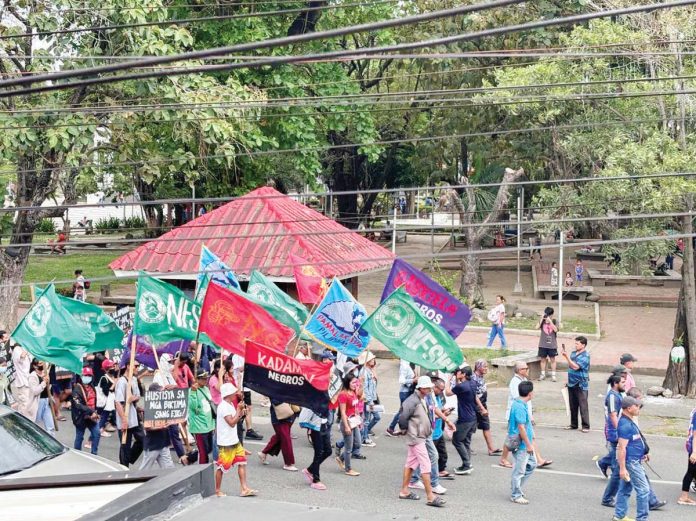 A group of activists from Negros Occidental marched and gathered at the Bacolod City Public Plaza to commemorate the anniversary of the EDSA People Power Revolution on Tuesday, Feb. 25, 2025.