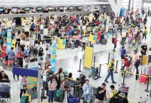 Passengers catch their respective flights at Ninoy Aquino International Airport (NAIA) terminal 3. PLUS.INQUIRER.NET/GRIG C. MONTEGRANDE FILE PHOTO