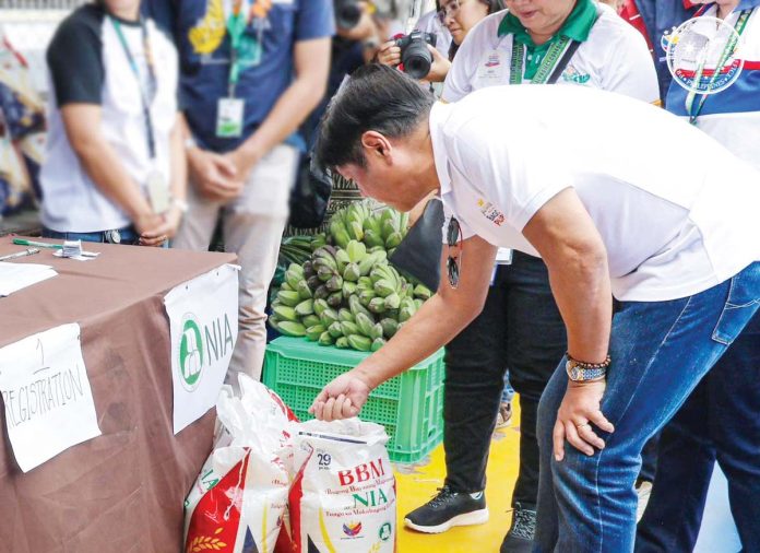 President Ferdinand Marcos Jr. checks the “Kadiwa ng Pangulo” store set up during the “Trabaho para sa Bagong Pilipinas para sa 4Ps” job fair at the Iloilo Sports Complex in La Paz, Iloilo City on February 13. PCO