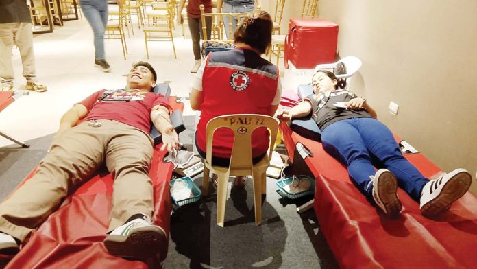 Volunteers donate blood during the Valentine’s-themed blood donation drive at Festive Walk Iloilo, emphasizing that the most meaningful gift this Love Month is the gift of life. The initiative encourages Ilonggos to be regular blood donors. IME SORNITO/PN