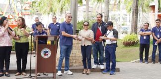 Provincial Administrator Raul Banias hands over a check to the Passi City Anti-Drug Abuse Council after being recognized as the best performing in the Component City to Second Class Municipality category in Iloilo. PHOTO FROM PROVINCIAL ADMINISTRATOR RAUL BANIAS FACEBOOK PAGE