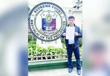 Former Iloilo City councilor Plaridel Nava II stands outside the Supreme Court, holding a copy of his petition challenging the executive clemency granted to former mayor Jed Patrick Mabilog.