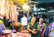 The Iloilo City Government says 324 vendors have so far completed training programs designed to improve their business skills, customer service, and market operations. Photo shows personnel of the city’s Local Economic Enterprise Office conducting meat inspection at a public market. LEEO PHOTO