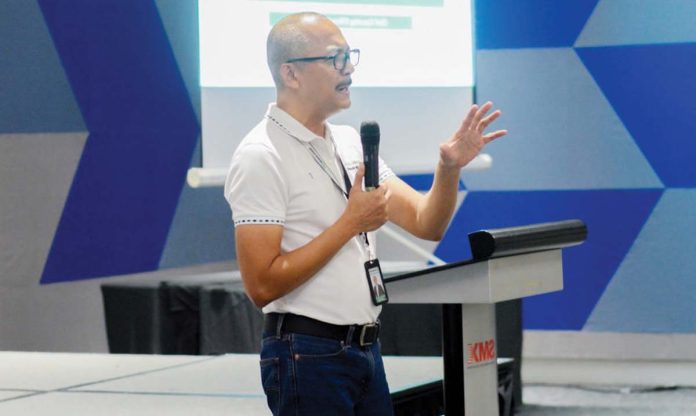 Engr. Bailey del Castillo, Chief Operations Officer of Negros Power, leads a dialogue with barangay officials and residents in Bacolod City during the "PaKAPe Program."