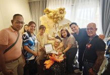 The 100-year-old Lola Josefina receives a P50,000 cash gift from the Roxas City Government. MAYOR RONNIE DADIVAS/FACEBOOK PHOTO