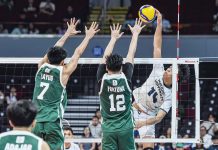 Negrense Leo Ordiales of National University Bulldogs scores against the defense of De La Salle University Green Spikers. UAAP PHOTO