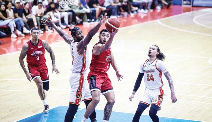 Barangay Ginebra San Miguel Kings’ Rhon Jay Abarrientos attempts a reverse layup against the defense of NorthPort Batang Pier’s Kadeem Jack. PBA PHOTO