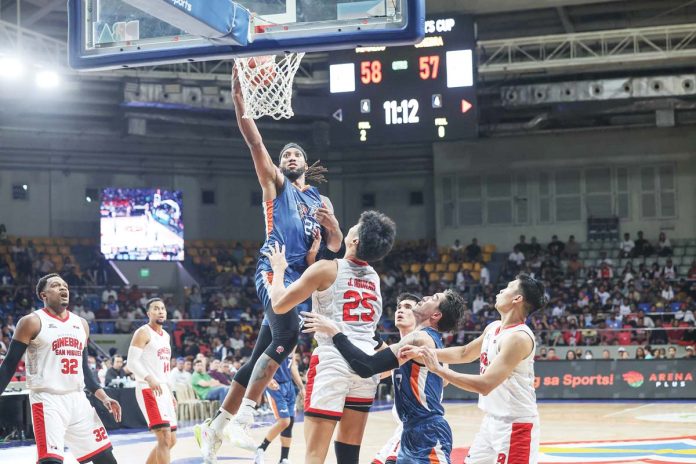 Meralco Bolts’ Akil Mitchell soars for a layup. PBA PHOTO