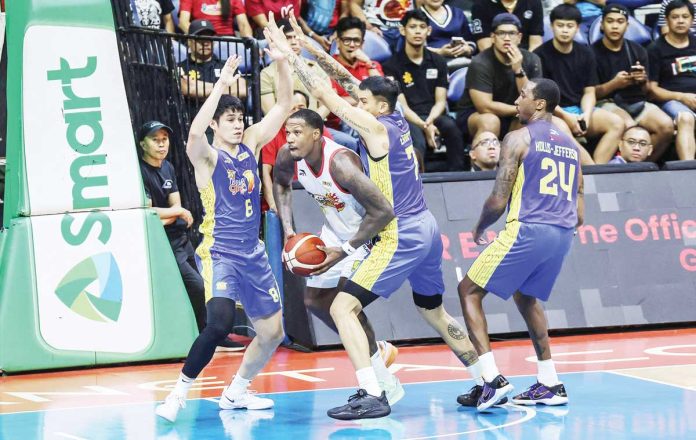 TNT Tropang Giga’s John Paul Erram and Calvin Oftana tightly defend Rain or Shine Elasto Painters’ Deon Thompson. PBA PHOTO