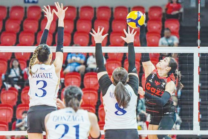 Petro Gazz Angels’ Brooke Van Sickle scores against the defense of ZUS Coffee Thunderbelles. PVL PHOTO