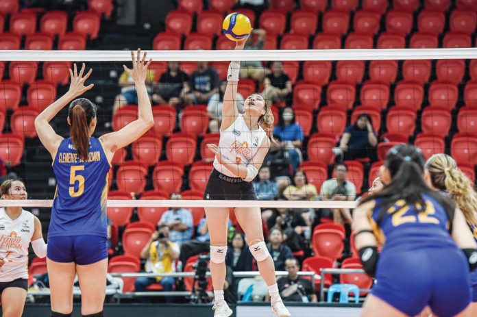 Rachel Anne Daquis of Farm Fresh Foxies drops the ball towards the Capital1 Solar Energy Solar Spikers’ defense. PVL PHOTO