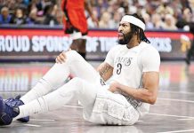 Dallas Mavericks’ Anthony Davis went down in the third quarter after experiencing tightness in his groin and quad area. JEROME MIRON//IMAGN IMAGES