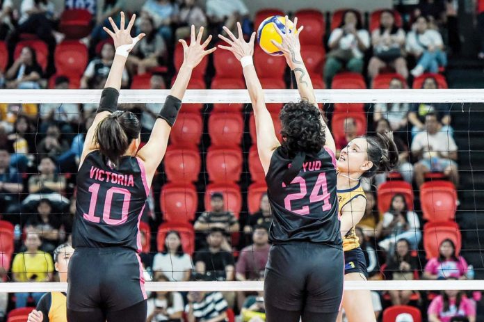 Capital1 Solar Energy Solar Spikers’ Leila Cruz had her shot blocked by the defense of Negrense Christine Joy Soyud of Akari Power Chargers. PVL PHOTO