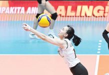 Negrense Cassie Carballo of University of Santo Tomas Golden Tigresses saves the ball. UAAP PHOTO