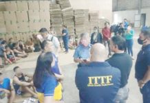 Philippine National Police - Criminal Investigation and Detection Group (PNP-CIDG) chief Brig. Gen. Nicolas Torre III (in police uniform) and other officials inspect the raided illegal cigarette factory in San Rafael, Bulacan on Nov. 6, 2024. The operation carried out in Bulacan and Valenzuela City on Nov. 6 to 7, 2024 led to the seizure of P2.4 billion worth of counterfeit cigarettes and smuggling equipment, and the rescue of 155 trafficked individuals. CIDG PHOTO