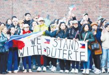 Supporters of former president Rodrigo Duterte wait for his arrival at the Scheveningen detention cell in The Hague, Netherlands. REUTERS