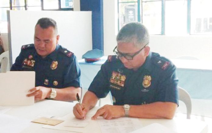 Officials of the Police Regional Office 6 cast their votes for national posts during the local absentee voting held at Camp General Martin Teofilo Delgado in Fort San Pedro, Iloilo City on April 29, 2019. PNA FILE PHOTO