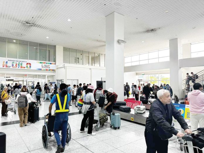 The Department of Tourism Region 6 is hoping to have more international direct flights to and from Iloilo following the resumption of flights from Iloilo to Hong Kong and from Iloilo to Singapore last year. Photo shows arriving passengers from Singapore claiming their baggage at the baggage claim area of the Iloilo International Airport. PHOTO COURTESY OF PDEA REGION 6